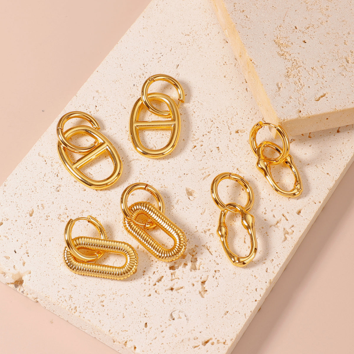 Little Heart Earrings, gold-tone solid, twisted and hollow heart earrings on stone