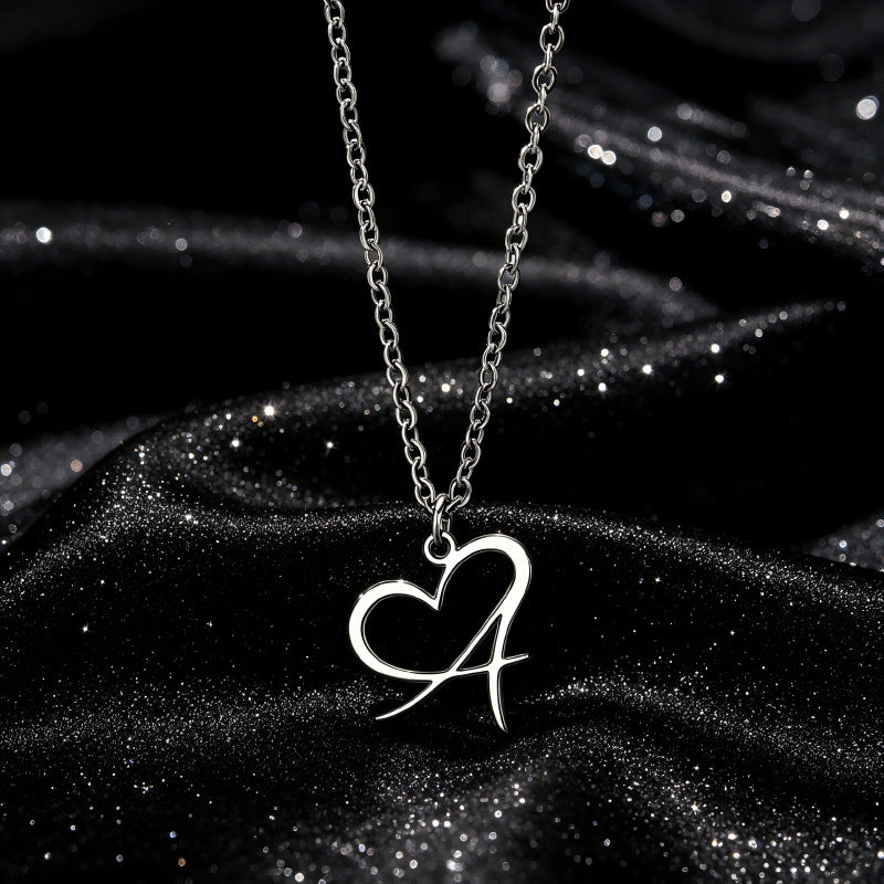 Heart Initial Necklace, silver-tone heart pendant with letter A close-up