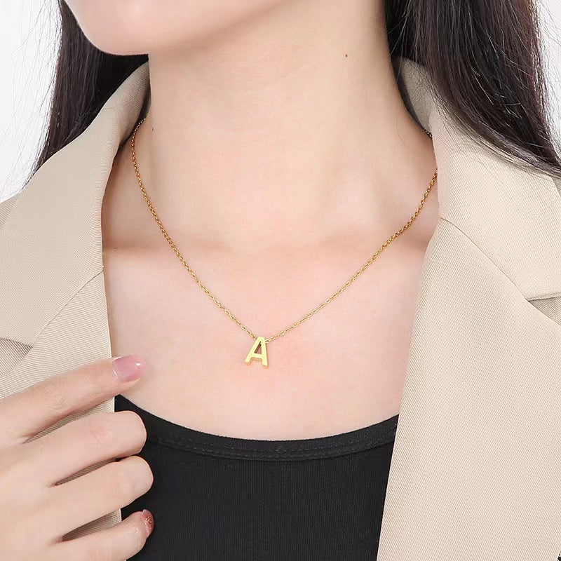 Initial Necklace, gold letter A pendant on a fine chain, worn at the neck