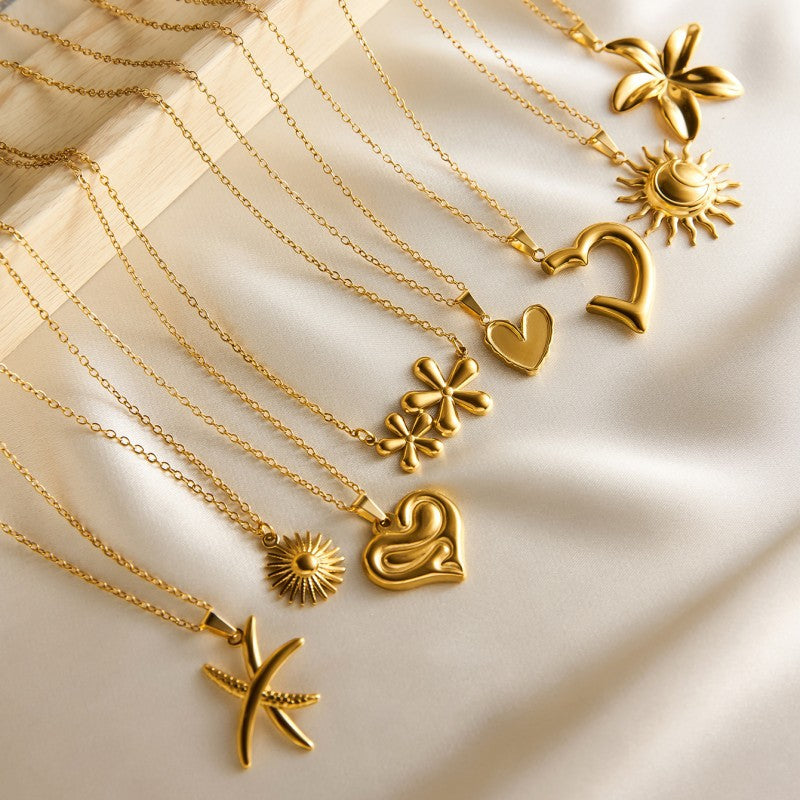 Halo Necklace, gold flower, sun and heart charm necklaces, flat view