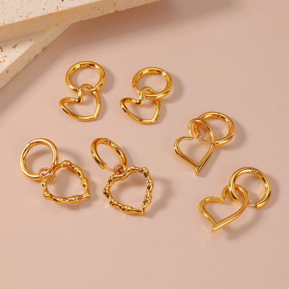 Little Heart Earrings, gold-tone heart earrings in several shapes, flat view
