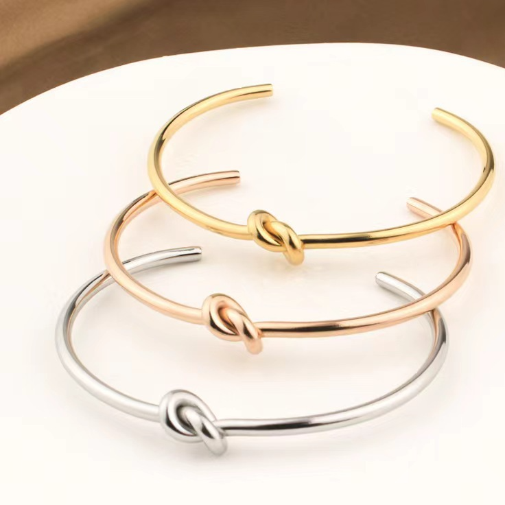 Love Knot Bangle, love knot bangles in gold-tone, rose-tone and silver-tone, flat view