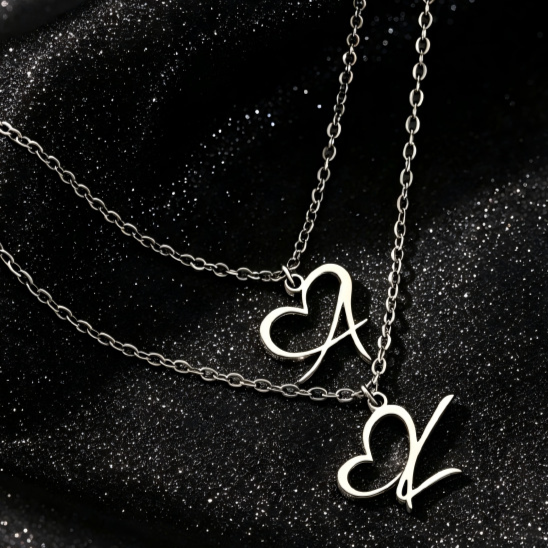 Heart Initial Necklace, silver-tone heart initial pendants on dark background