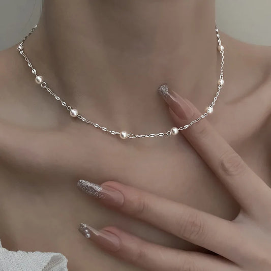 Perla Pearl Necklace, silver-tone chain with pearl beads, worn at the neck